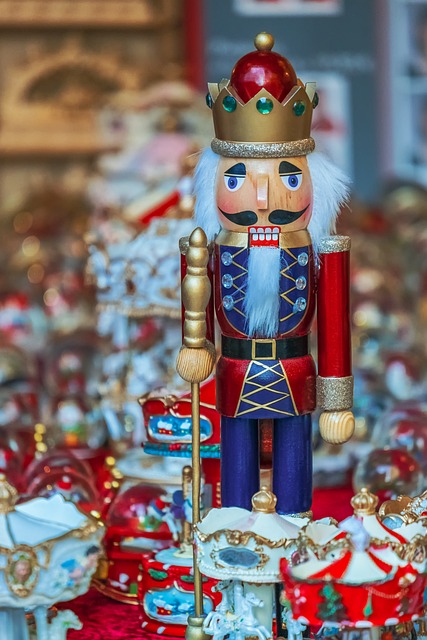 A large Christmas nutcracker made out of wood and painted golden and red