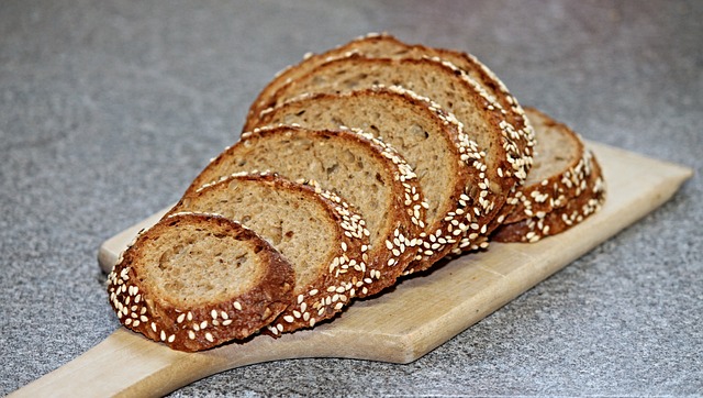 German bread sliced up on a board ready to eat.