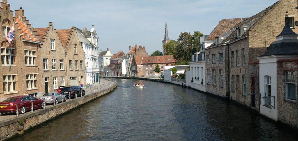 A view of a canal lined with historic buildings in Bruge