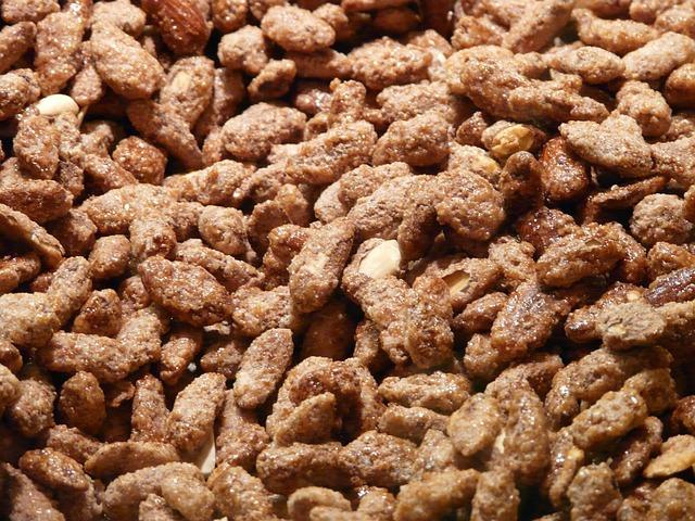 A close up of a display of roasted almonds